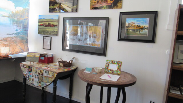 A display of photography by Don Wisdom graces one wall of the Wandering Gypsy.